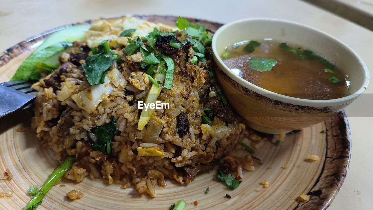 food and drink, food, healthy eating, wellbeing, dish, freshness, asian food, cuisine, chinese food, bowl, indoors, vegetable, meal, no people, produce, table, close-up, plate, meat, thai food, herb, high angle view, rice, serving size, still life, biryani, spice