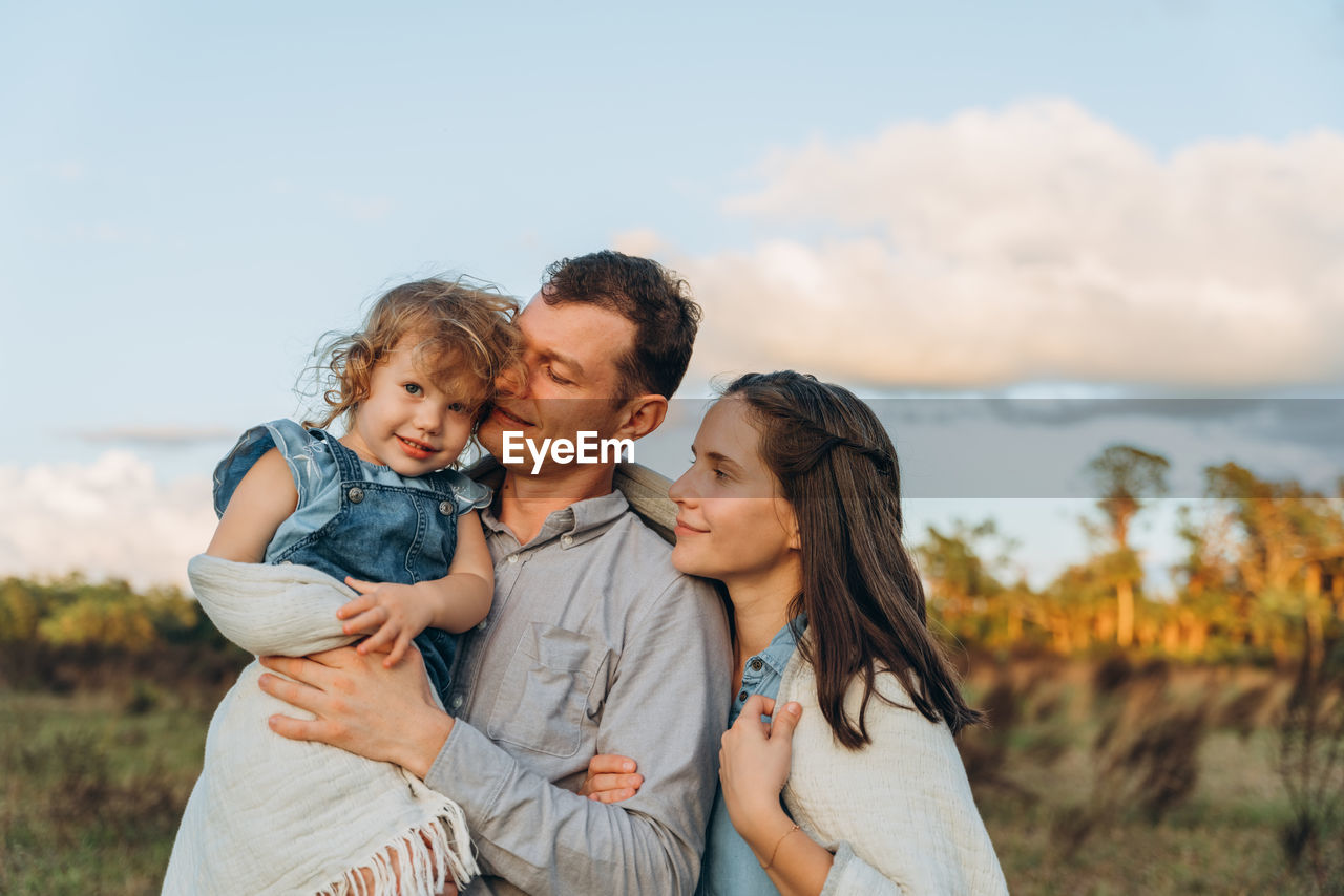 Young couple with cute two-years-old girl