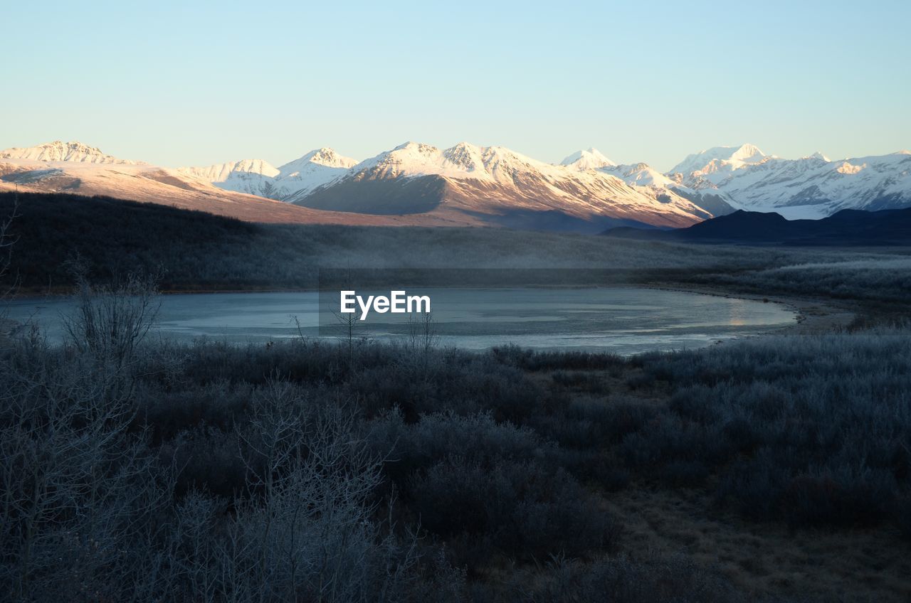 Scenic view of snowcapped mountains against sky