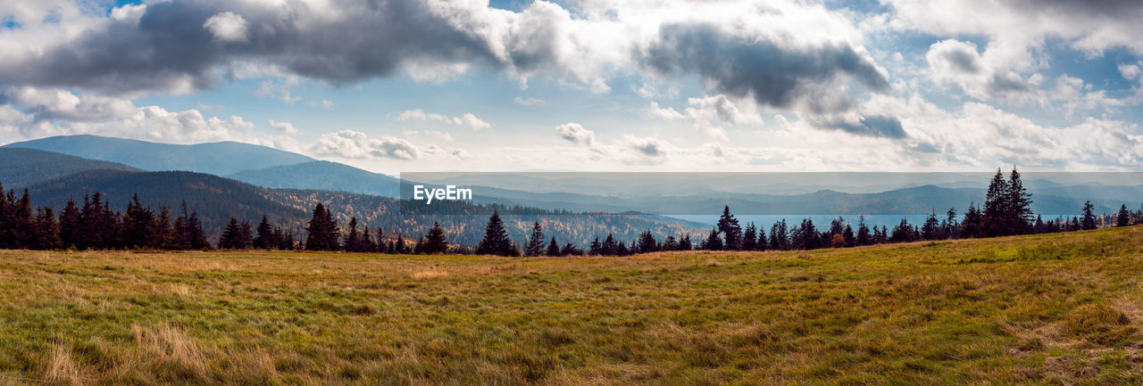 Lovely view of the mountain valleys. solar panels and mountain meadow in the foreground. 