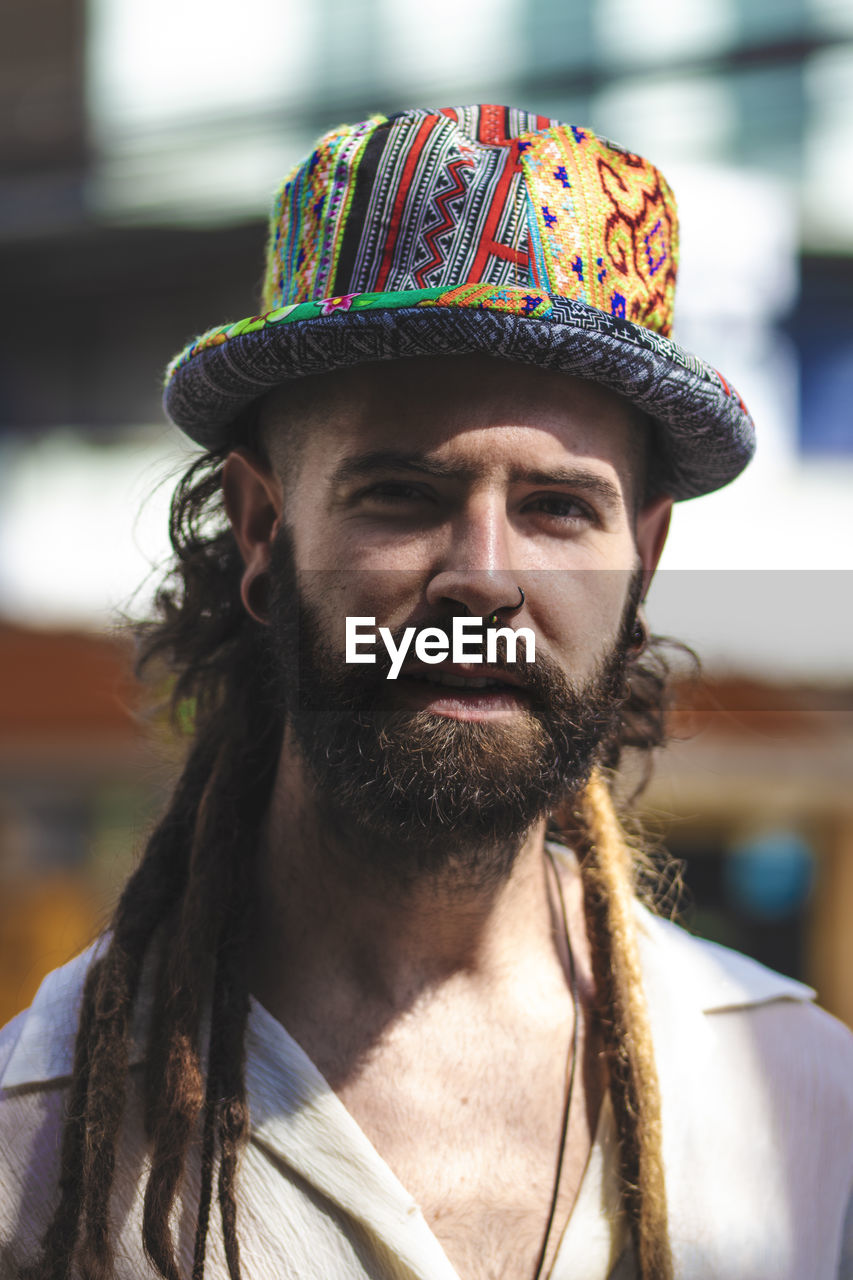 Close-up portrait of man wearing hat