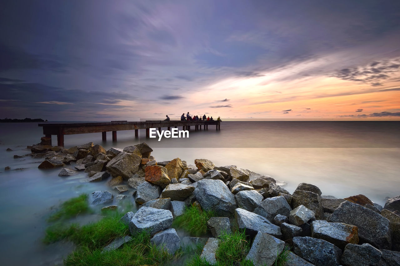 Scenic view of sea against sky at sunset