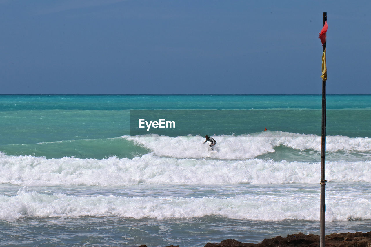 Man surfing on sea waves