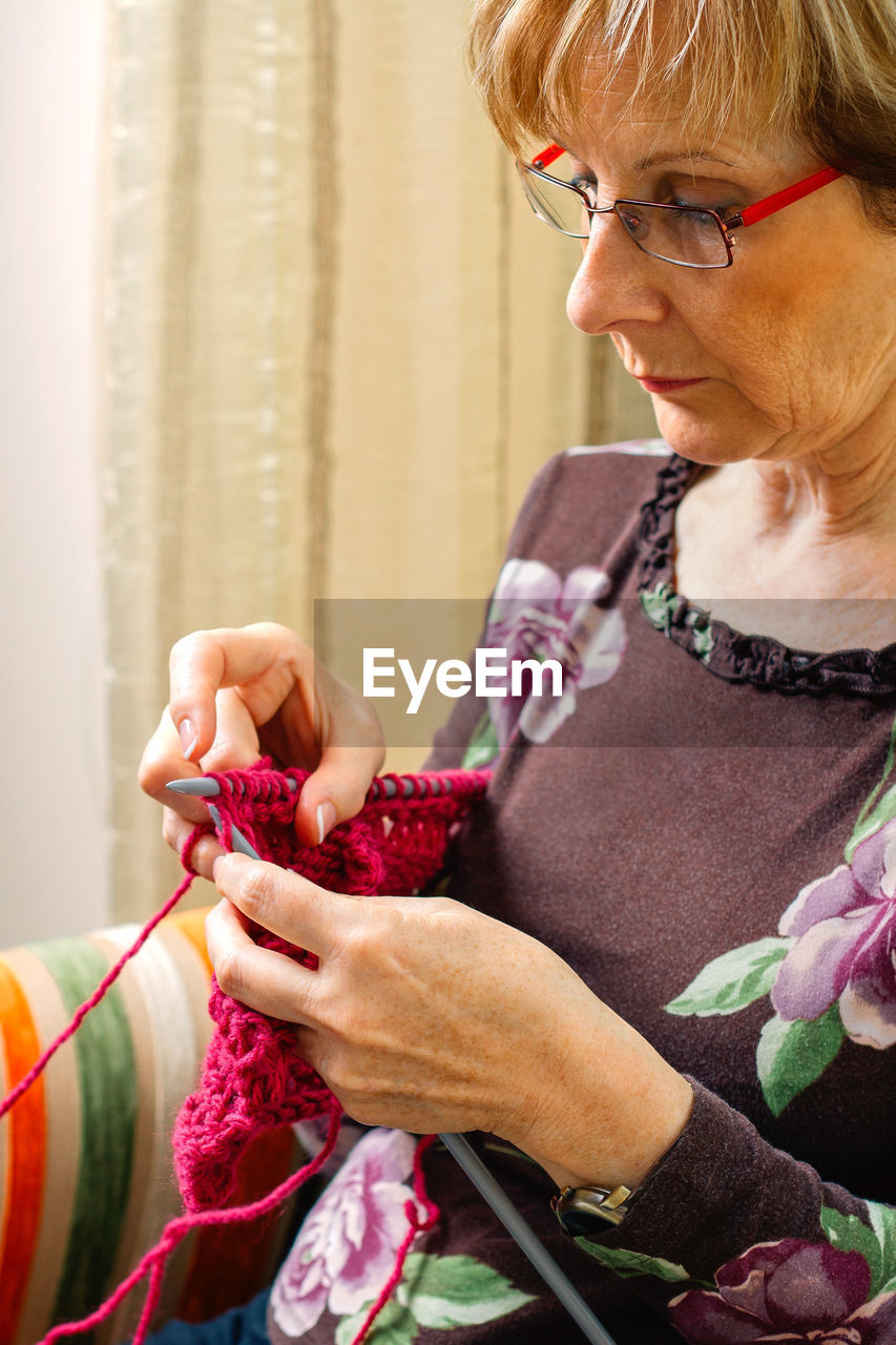 Woman knitting a wool sweater