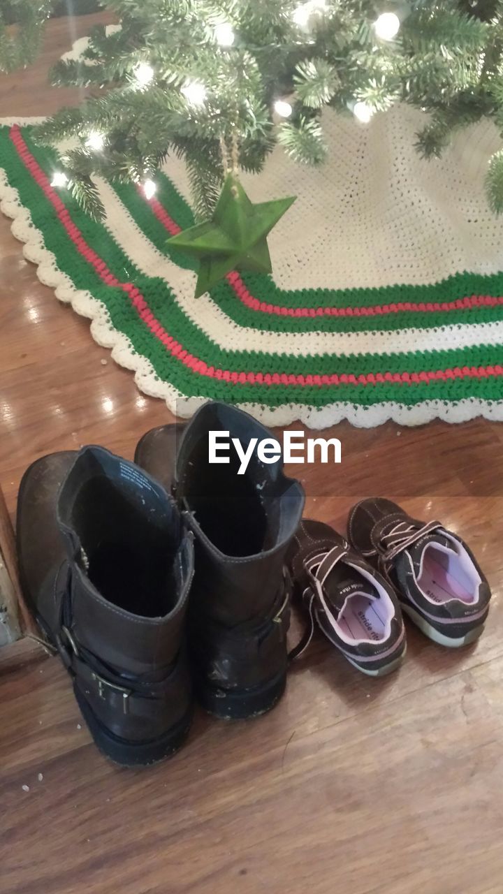 High angle view of shoes on hardwood floor