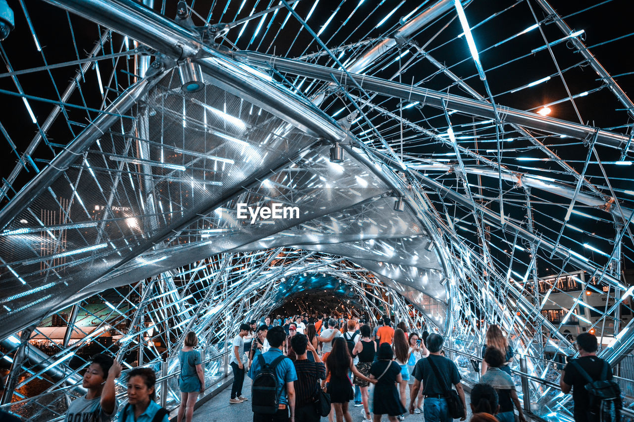 GROUP OF PEOPLE IN ILLUMINATED CEILING