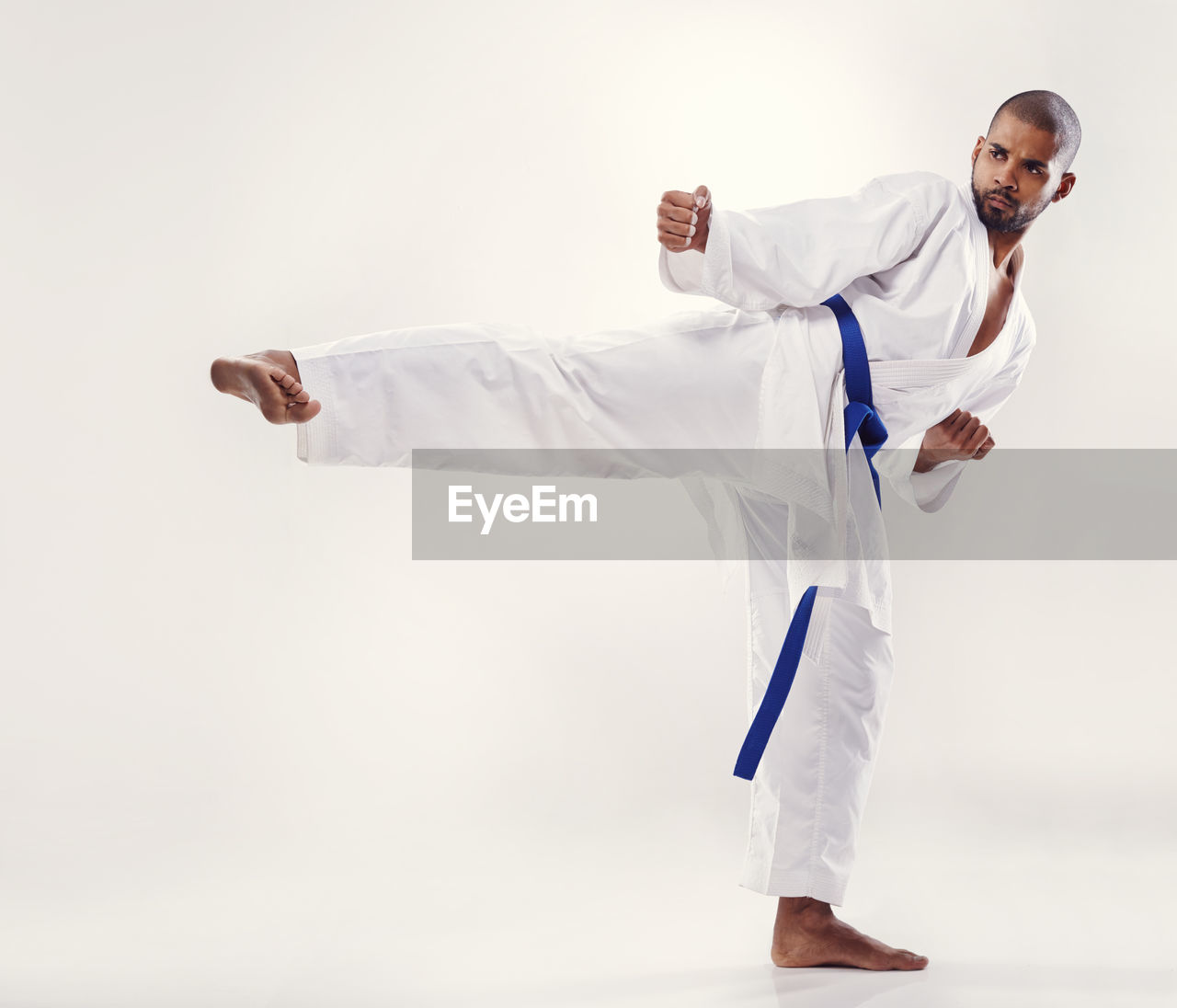 martial arts, sports, men, adult, one person, contact sport, indoors, studio shot, full length, clothing, combat sport, person, motion, karate, cut out, copy space, individual sports, healthcare and medicine, white, portrait, young adult, expertise, athlete