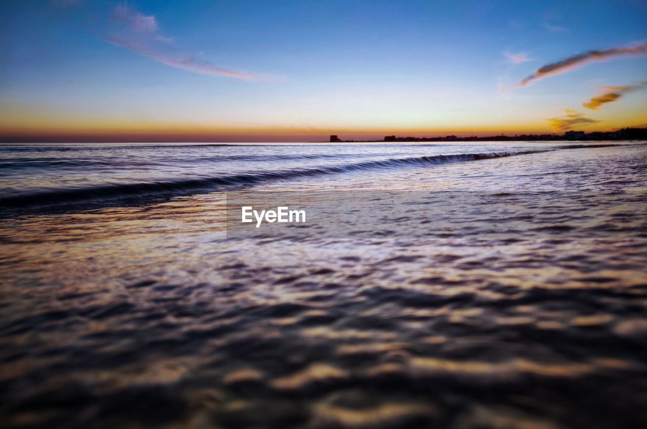 SCENIC VIEW OF SEA DURING SUNSET