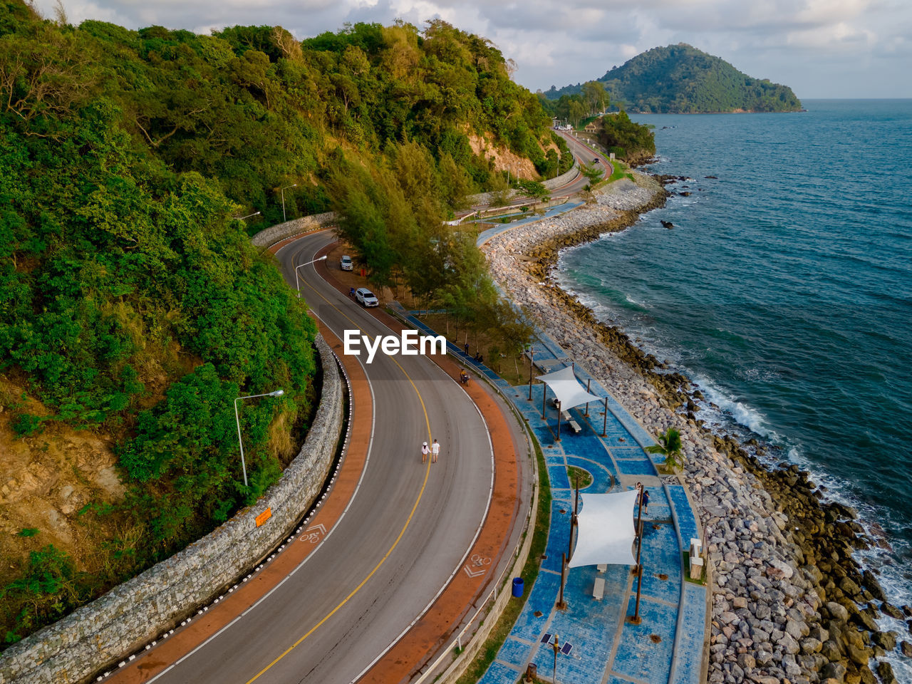 high angle view of road by sea against mountain