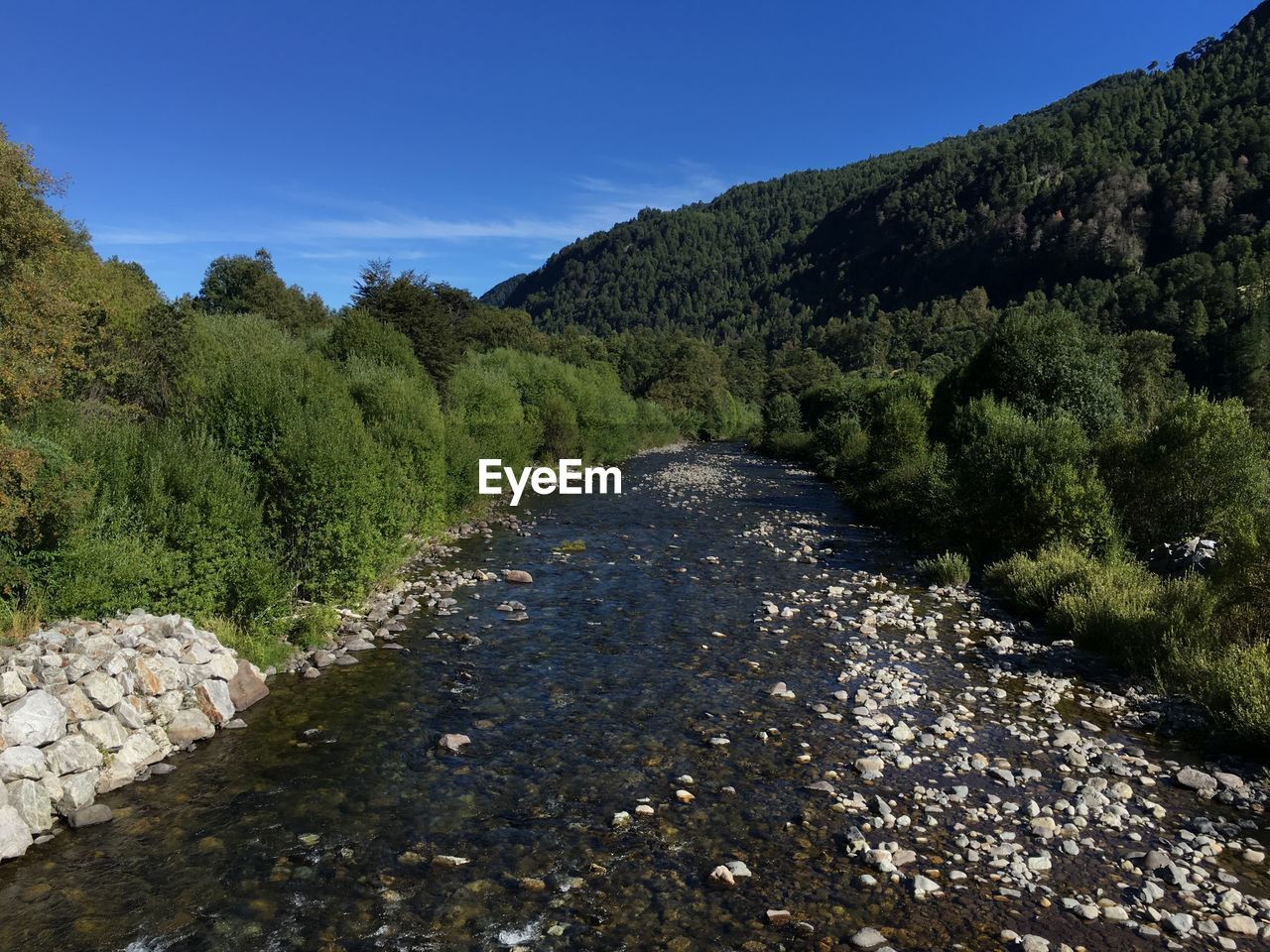 High angle view of river against blue sky