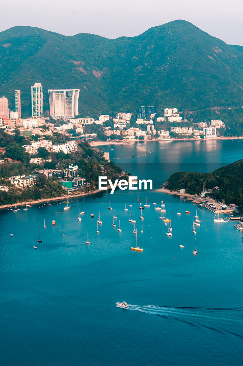 View of boats middle islands buildings in seaside at deep water bay hong kong seen form brick hill 