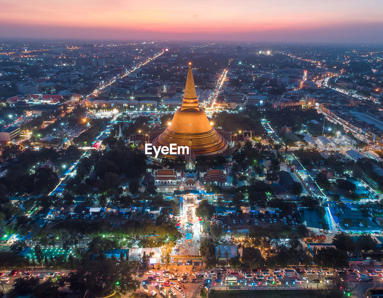 AERIAL VIEW OF ILLUMINATED BUILDINGS IN CITY