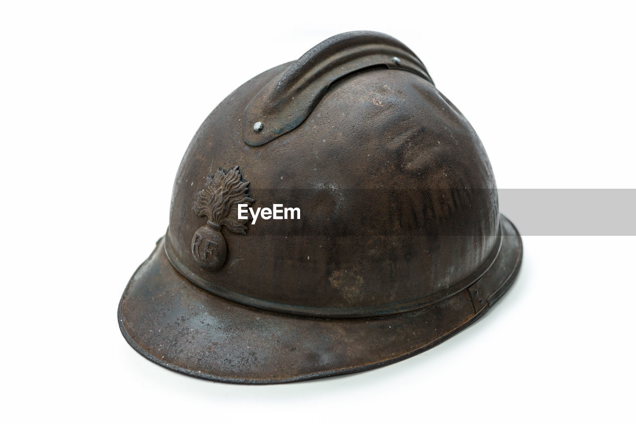 Close-up of old hardhat against white background