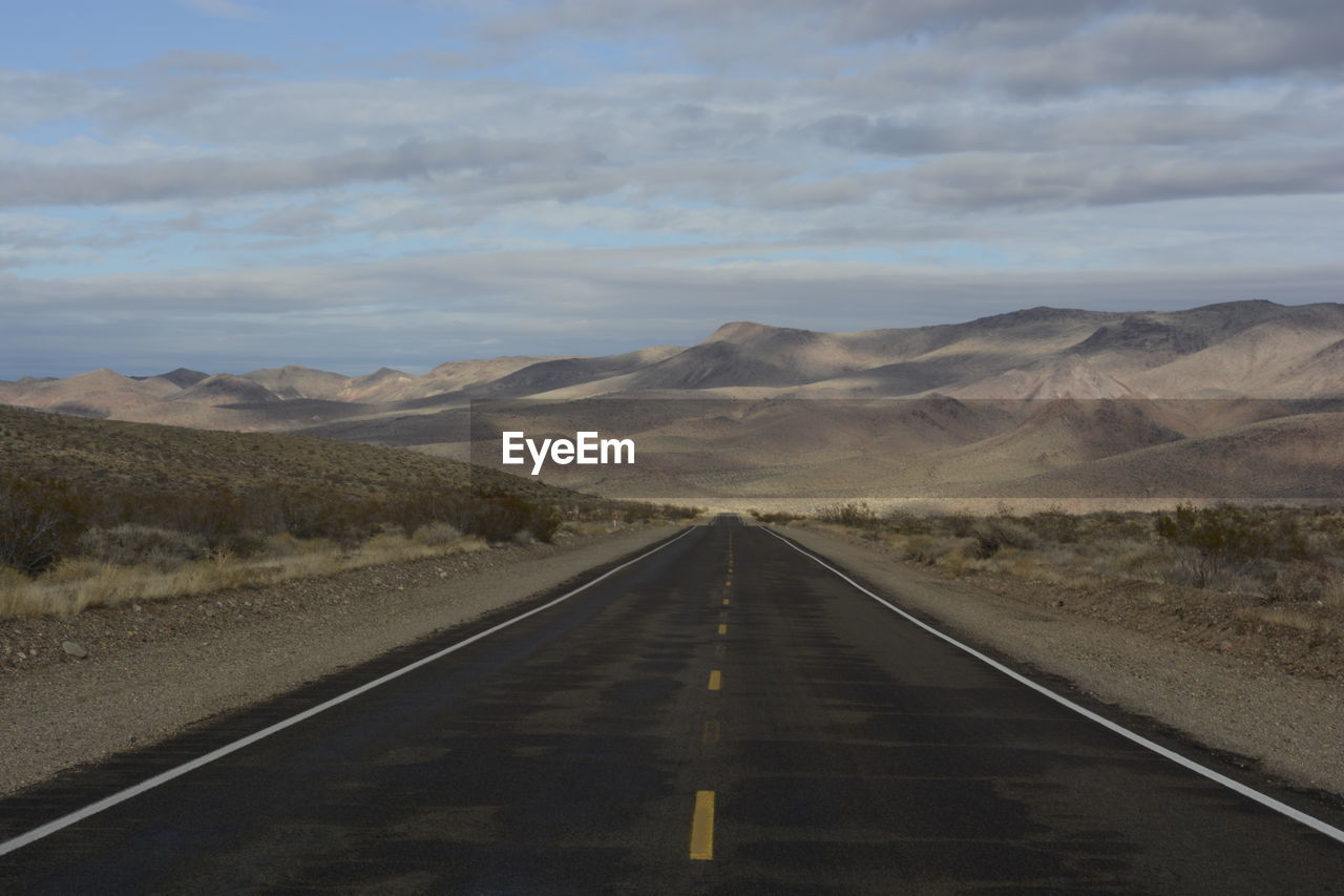 Road amidst landscape against sky