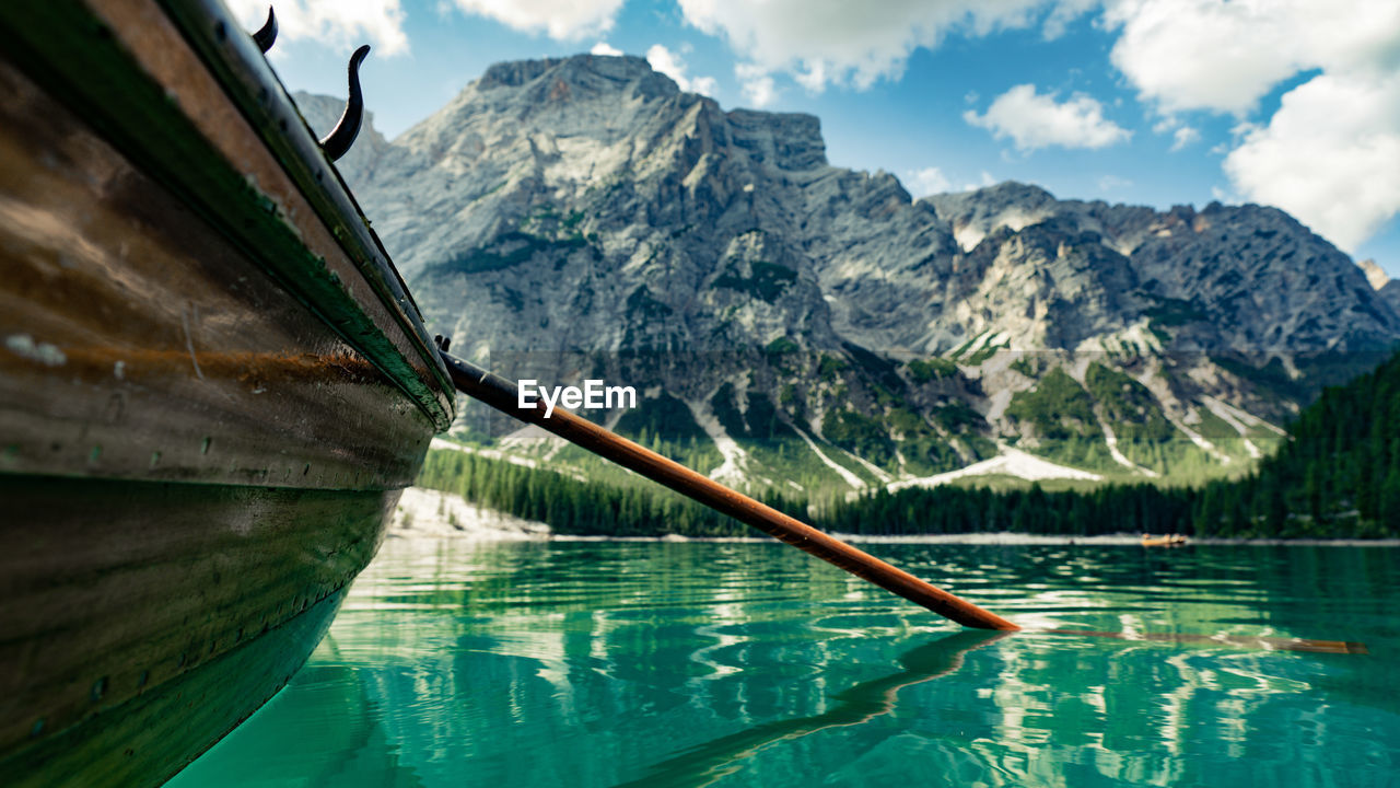 SCENIC VIEW OF LAKE AGAINST MOUNTAIN RANGE