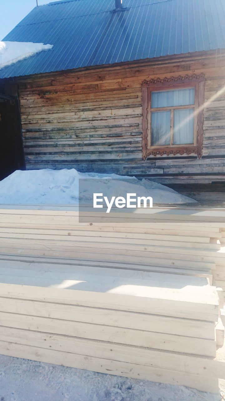 CLOSE-UP OF BARN AGAINST SKY