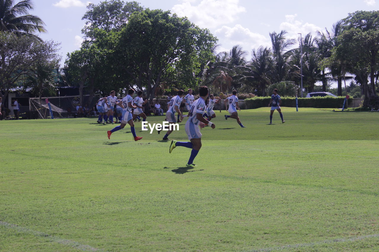 GROUP OF PEOPLE PLAYING SOCCER