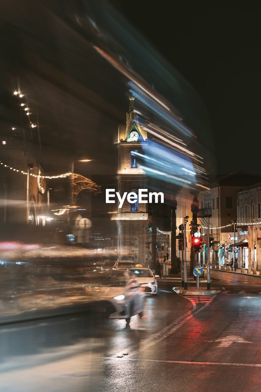 Illuminated city street at night