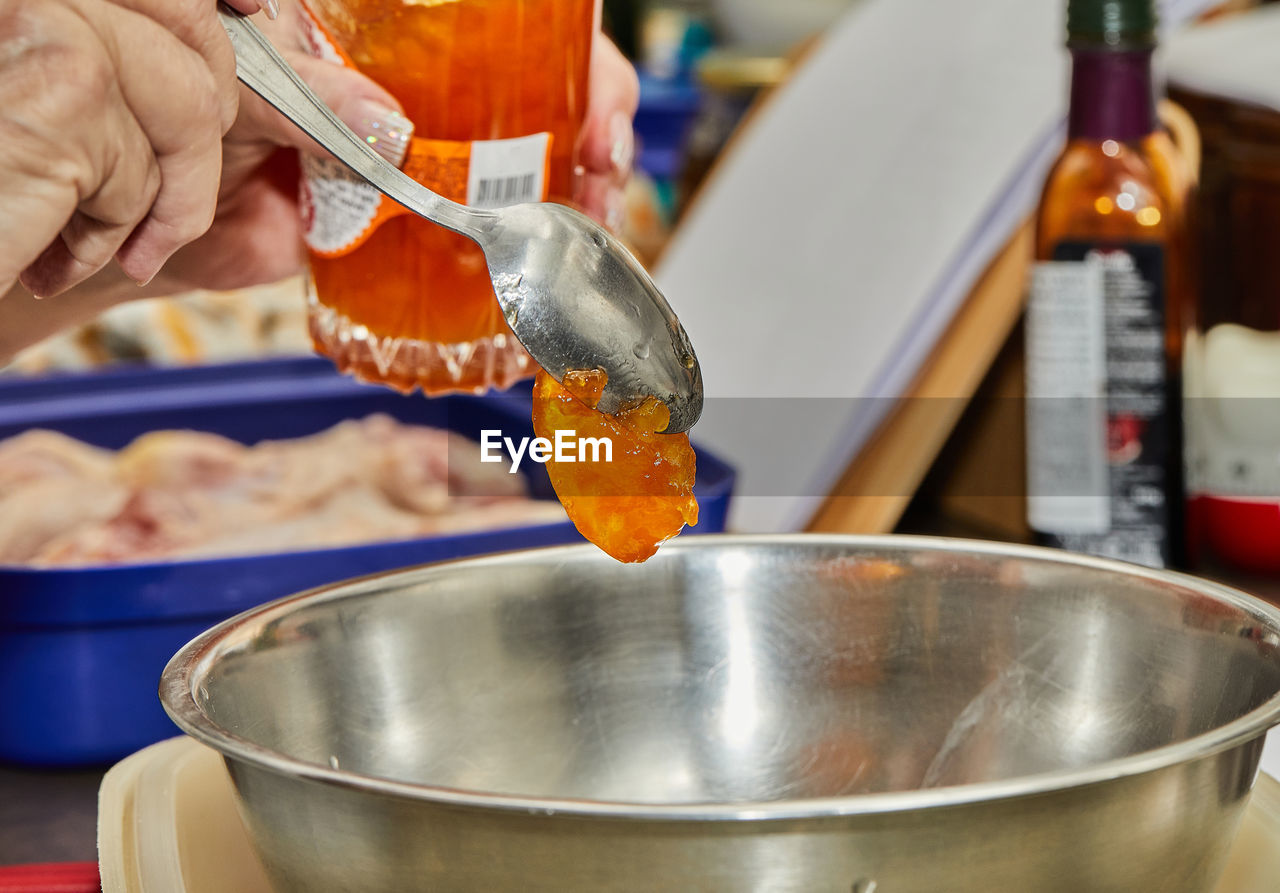 Chef ads jam to the chicken leg marinade bowl