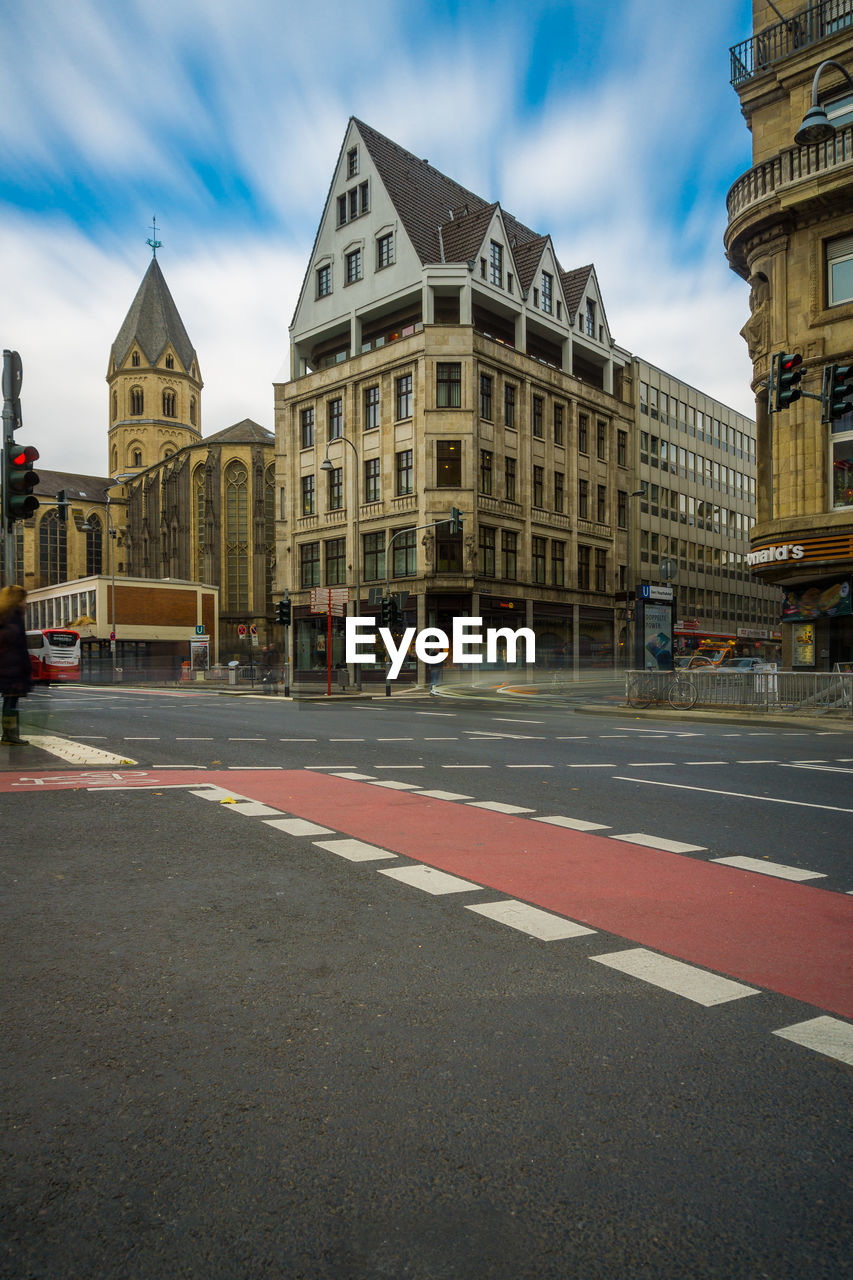 VIEW OF ROAD AGAINST BUILDINGS