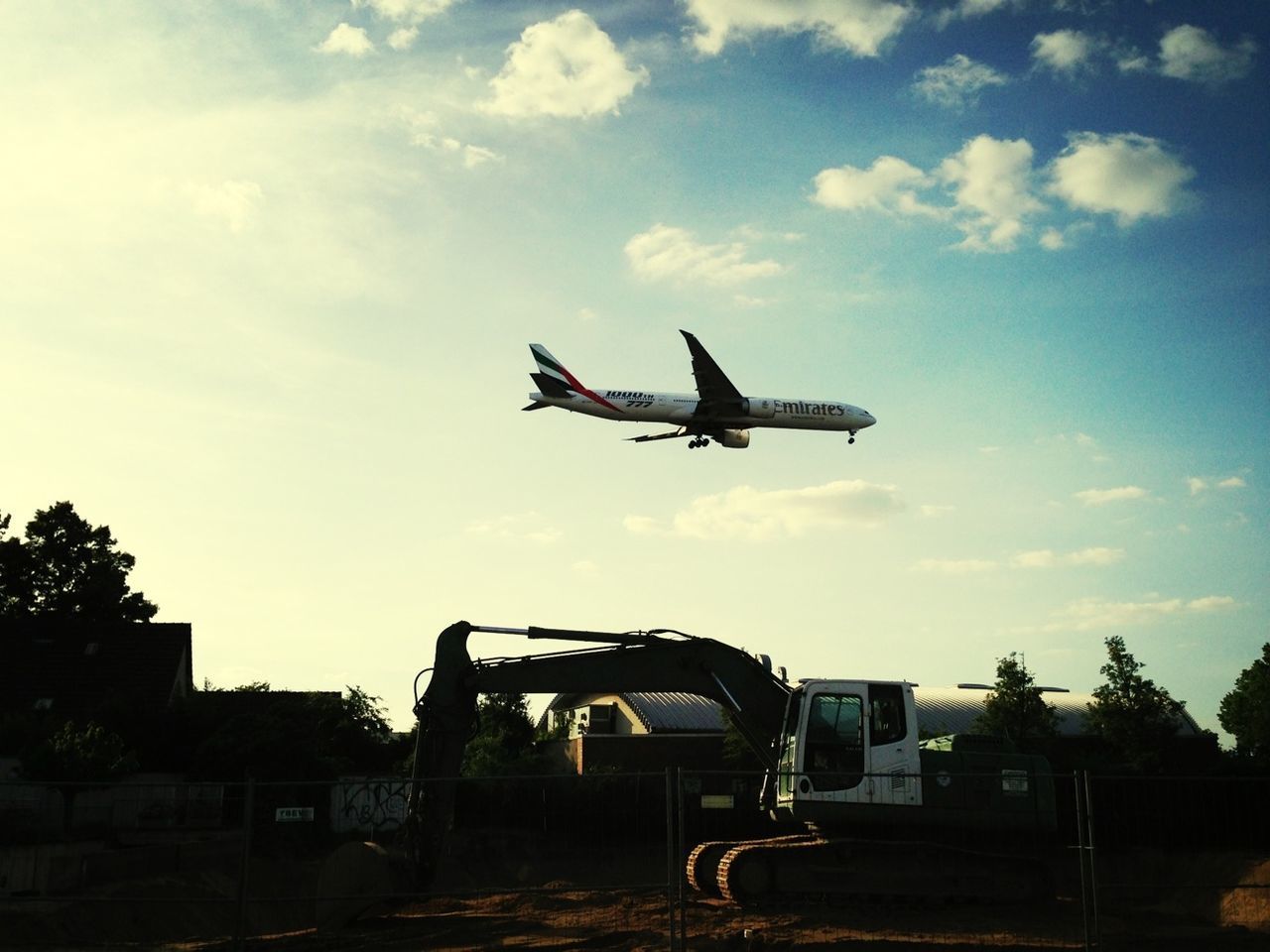 LOW ANGLE VIEW OF AIRPLANE FLYING IN SKY