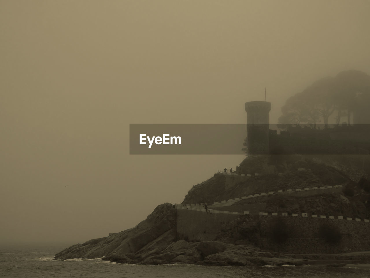 Scenic view of sea against sky during foggy weather