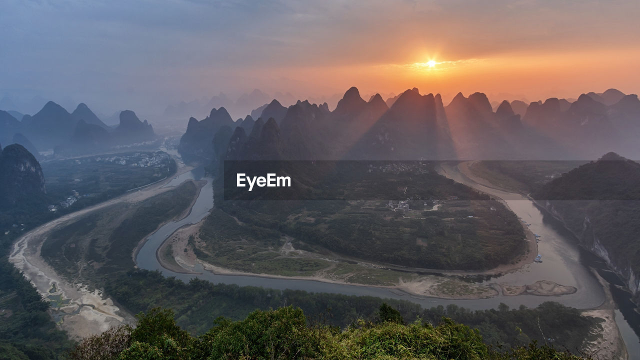 Aerial view of mountains during sunrise