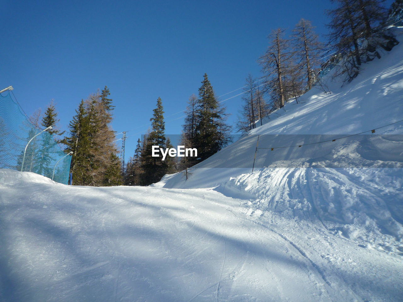 SNOW COVERED LANDSCAPE AGAINST SKY