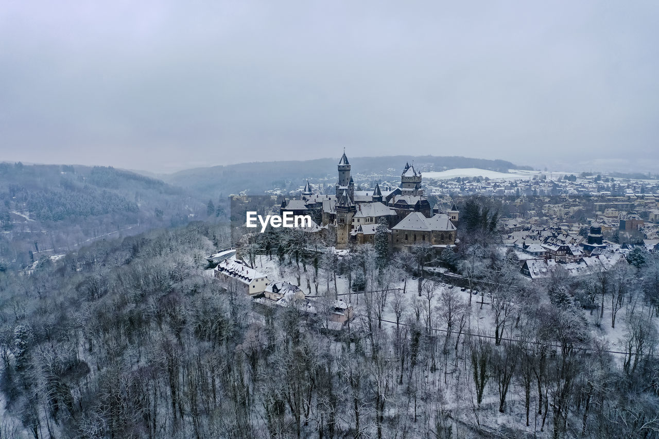 Germany, hesse, braunfels, helicopter view of braunfels castle and surrounding town in winter