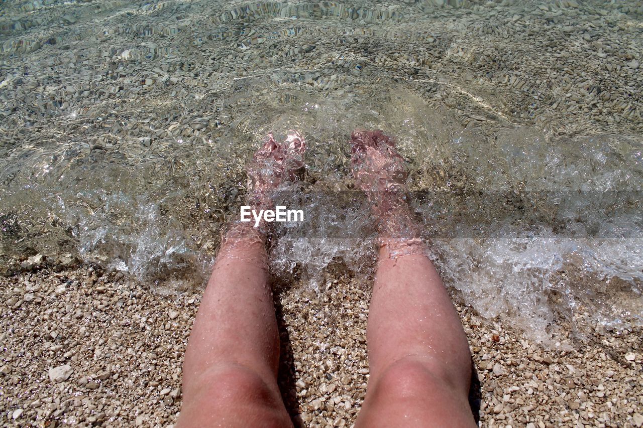 Low section of person on beach