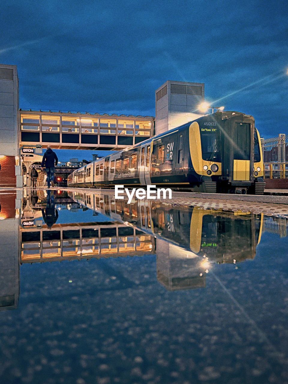 reflection, water, architecture, vehicle, sky, built structure, transport, transportation, nature, bridge, no people, outdoors, building exterior, dock, city, cloud, mode of transportation, industry