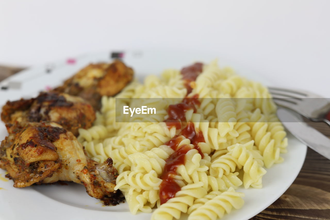 food, food and drink, fusilli, rotini, plate, cuisine, freshness, dish, healthy eating, wellbeing, spaghetti, indoors, italian food, meal, pasta, no people, vegetable, close-up, produce, meat, fork, focus on foreground, vegetarian food, eating utensil, kitchen utensil