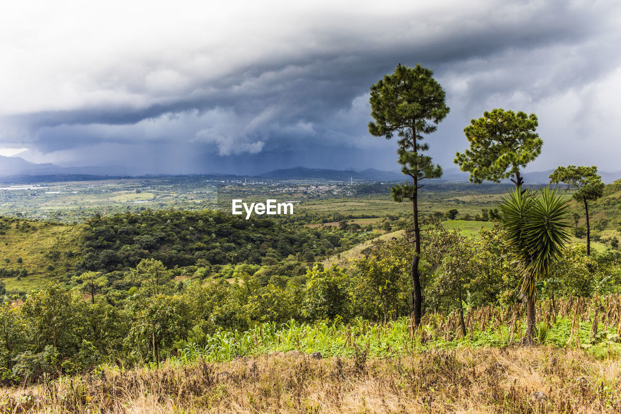 View of tropical storm in distance from a mountain in guatemala.