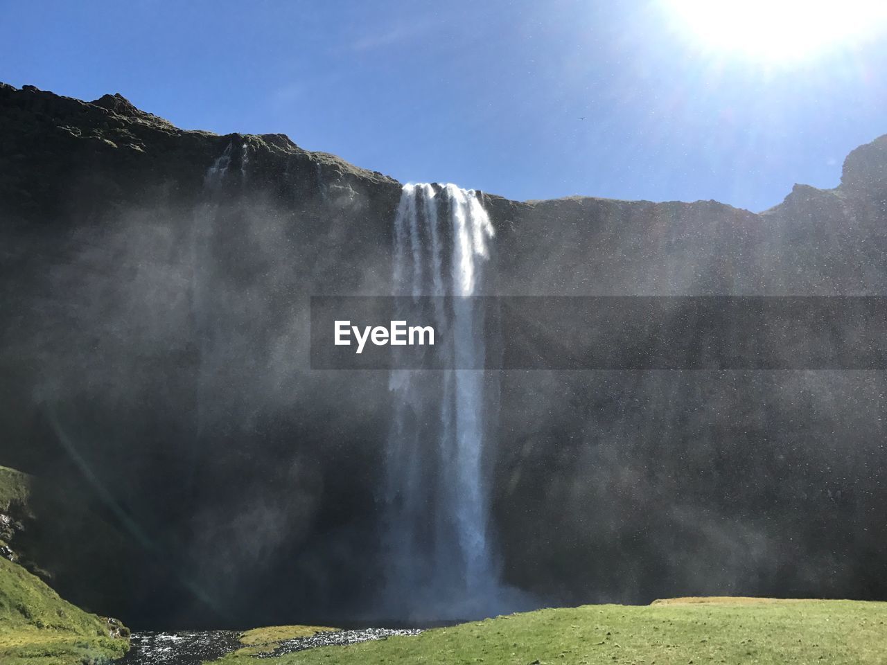 VIEW OF WATERFALL AGAINST SKY