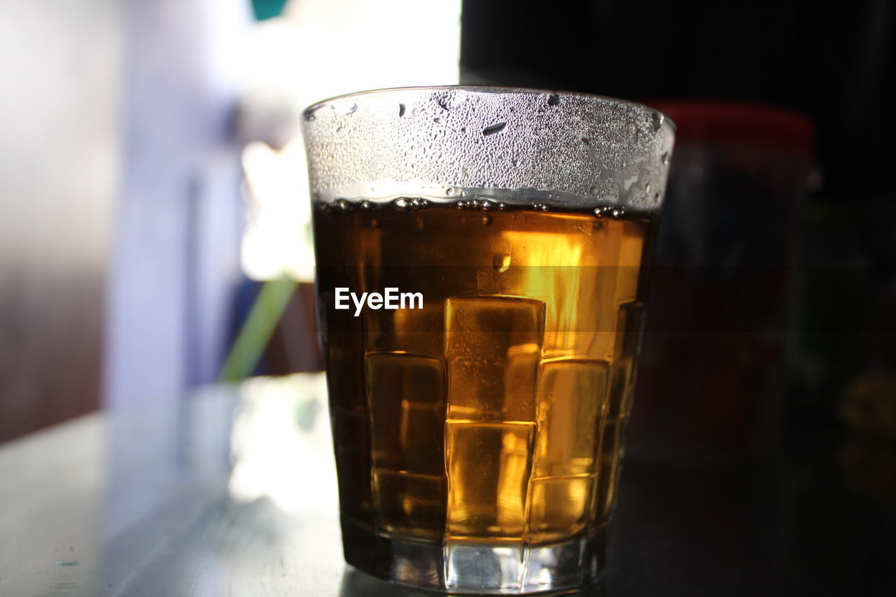 CLOSE-UP OF GLASS OF BEER IN GLASSES