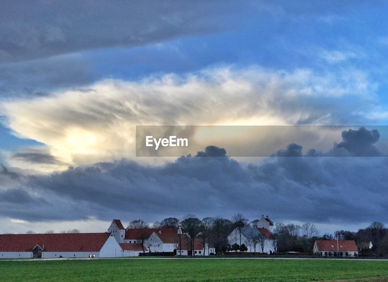 BUILT STRUCTURE ON FIELD AGAINST SKY