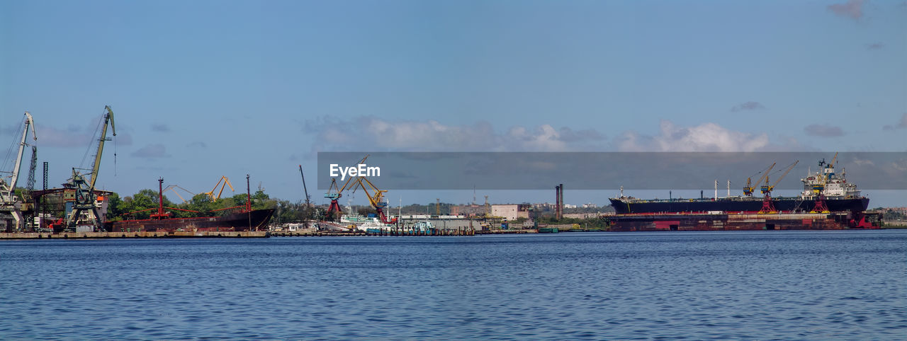 COMMERCIAL DOCK AGAINST SKY