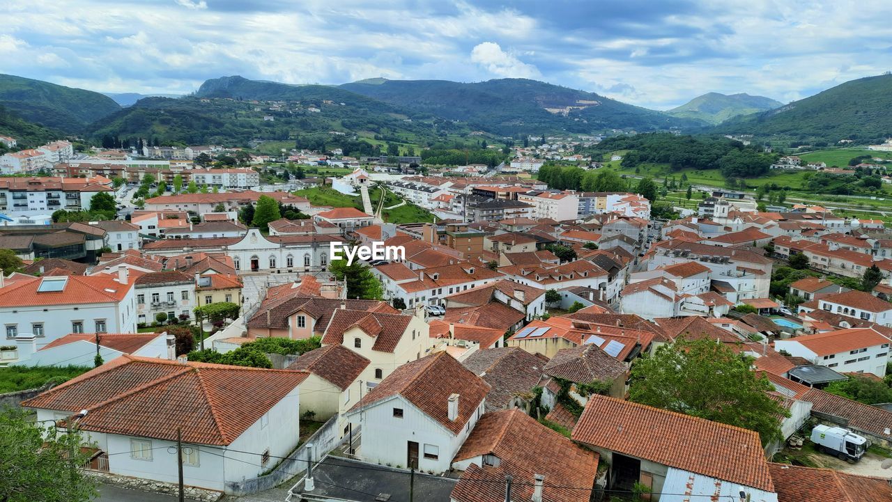 high angle view of townscape against mountain