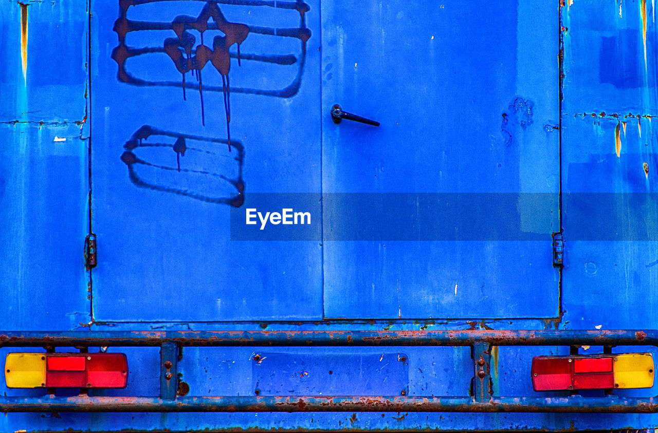 FULL FRAME SHOT OF CLOSED BLUE DOOR