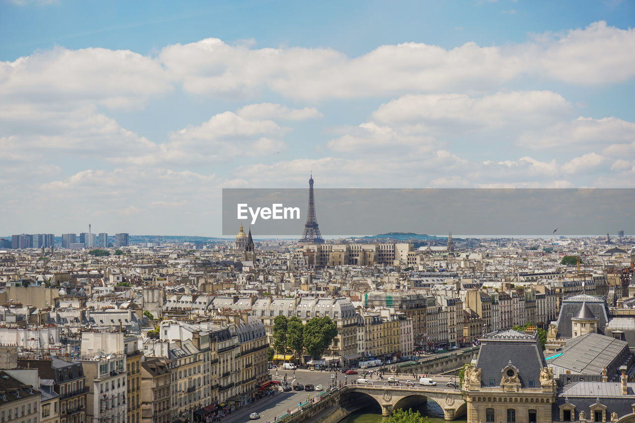 Distant view of eiffel tower amidst cityscape