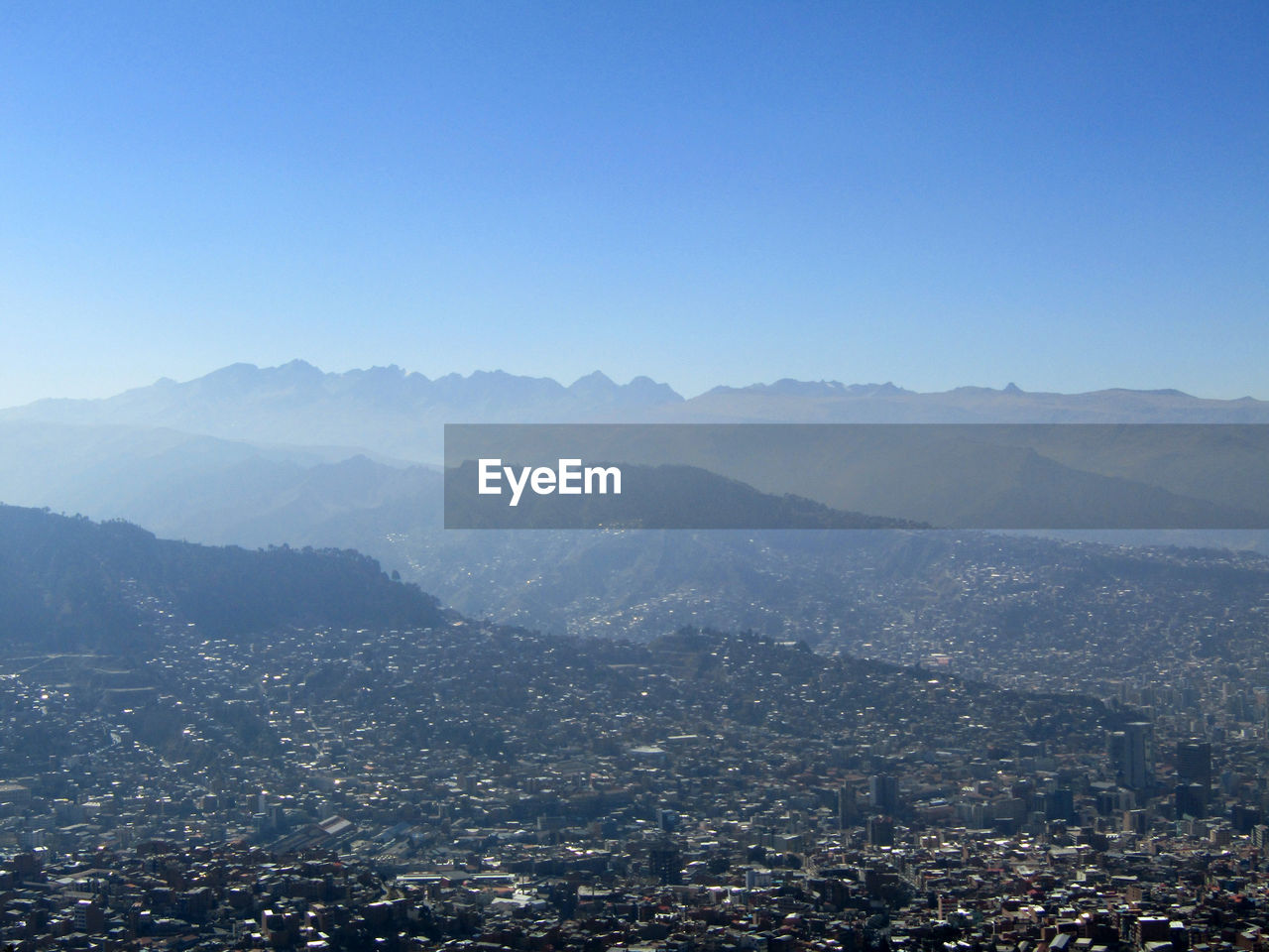 High angle view of buildings in city against clear sky
