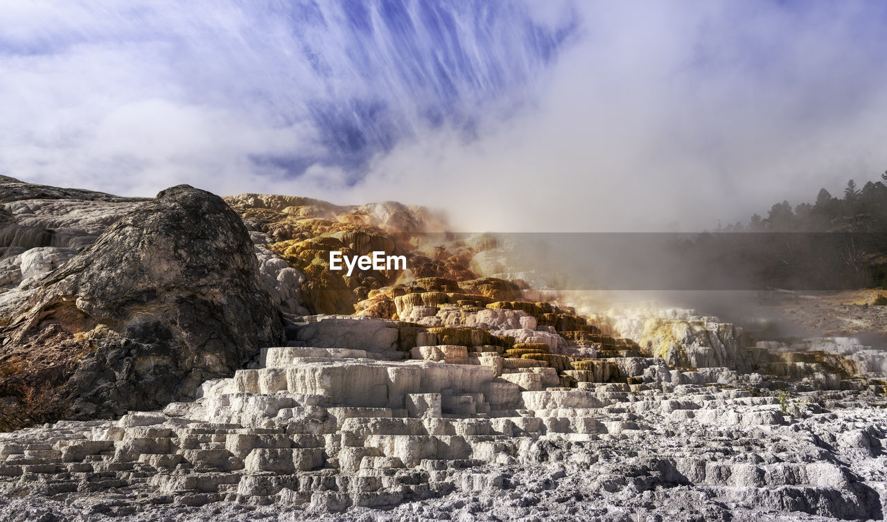 Scenic view of clouds over mountain