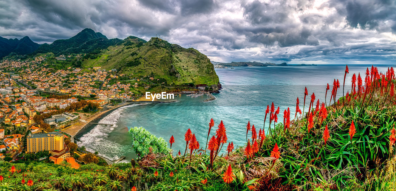 Scenic view of sea coast of madeira island against sky.