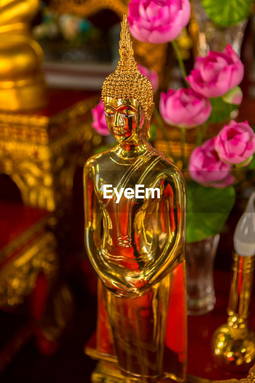 CLOSE-UP OF STATUE OF BUDDHA