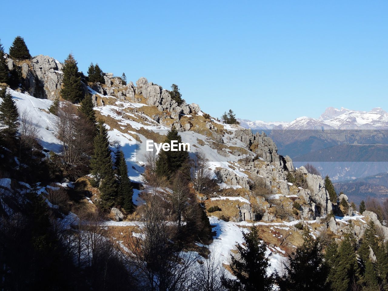 scenic view of snowcapped mountains against clear sky