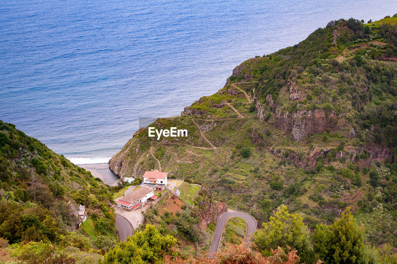 High angle view of buildings by sea