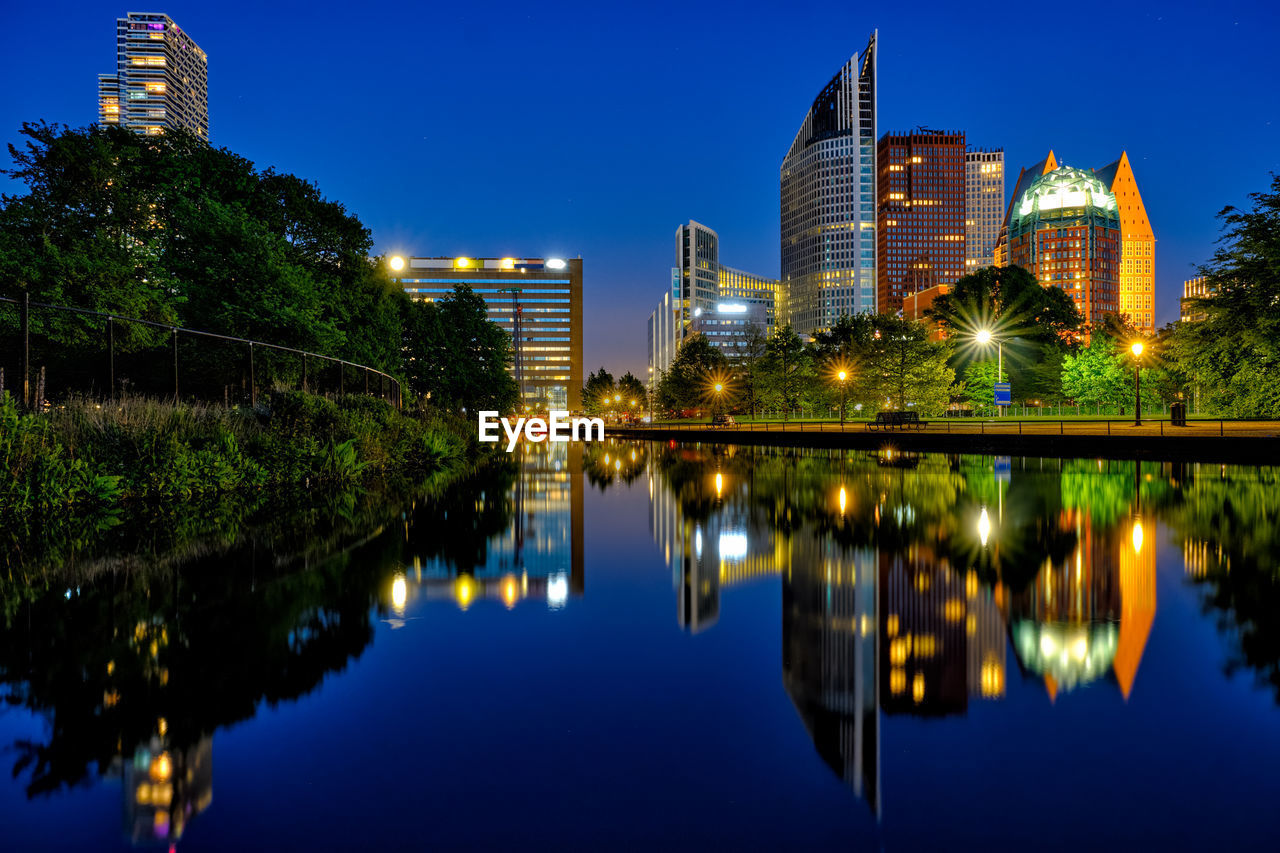 REFLECTION OF ILLUMINATED BUILDINGS IN LAKE