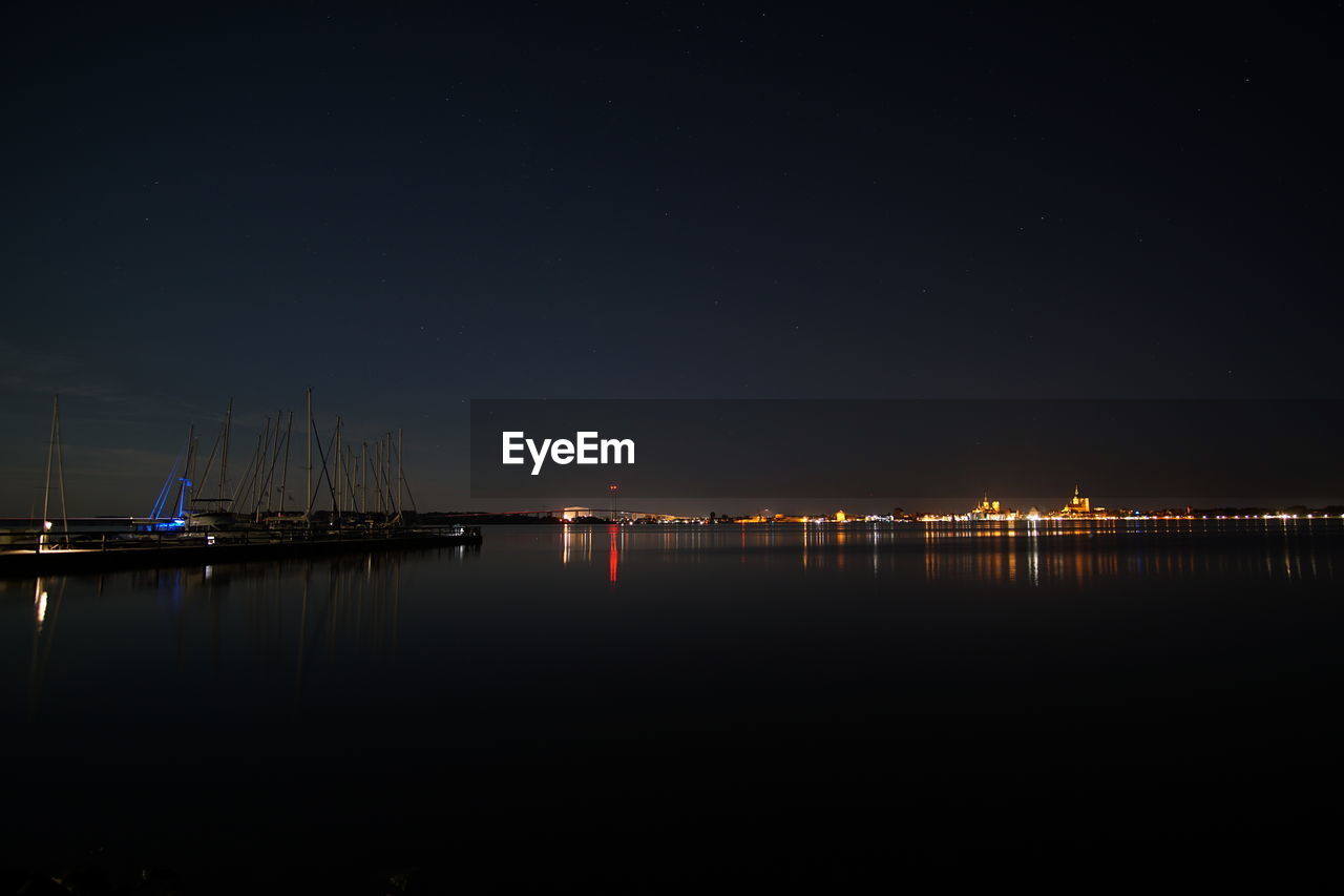 Scenic view of sea against sky at night