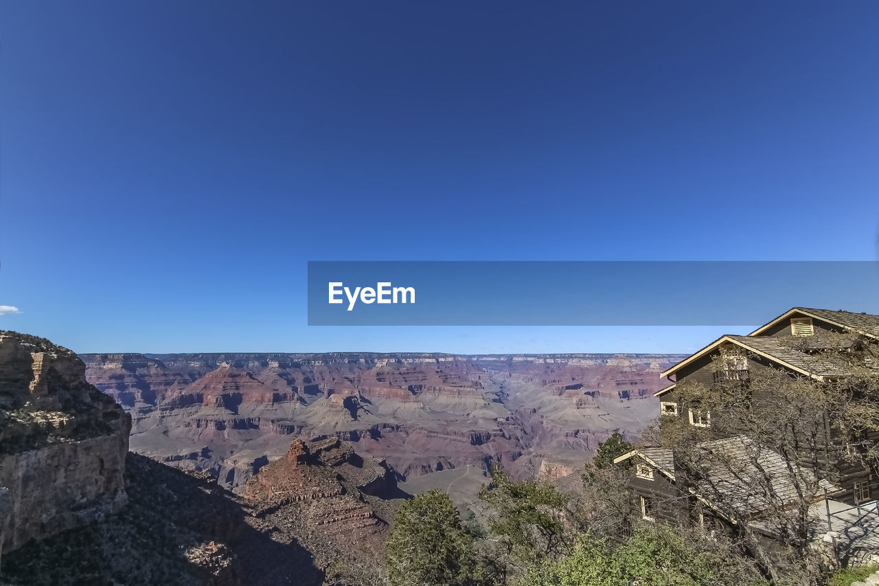 SCENIC VIEW OF MOUNTAIN AGAINST CLEAR BLUE SKY