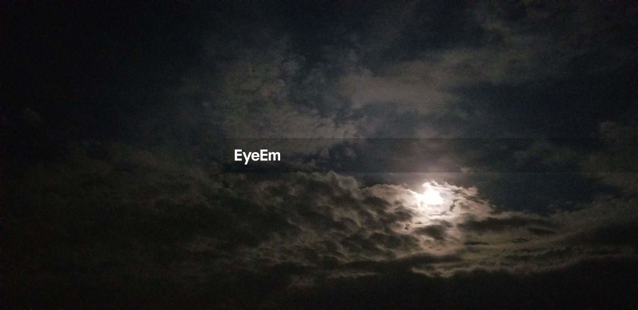 LOW ANGLE VIEW OF MOON IN SKY